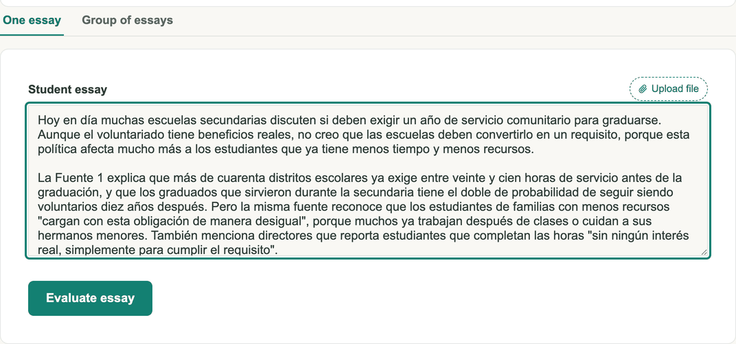 Screenshot: the grader with a student essay pasted in, tabs for one essay or a group of essays, and an Evaluate essay button